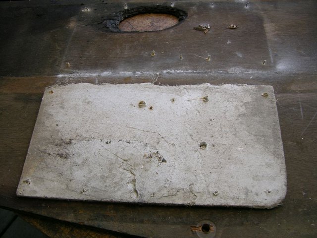 bottom side showing displaced asbestos panel